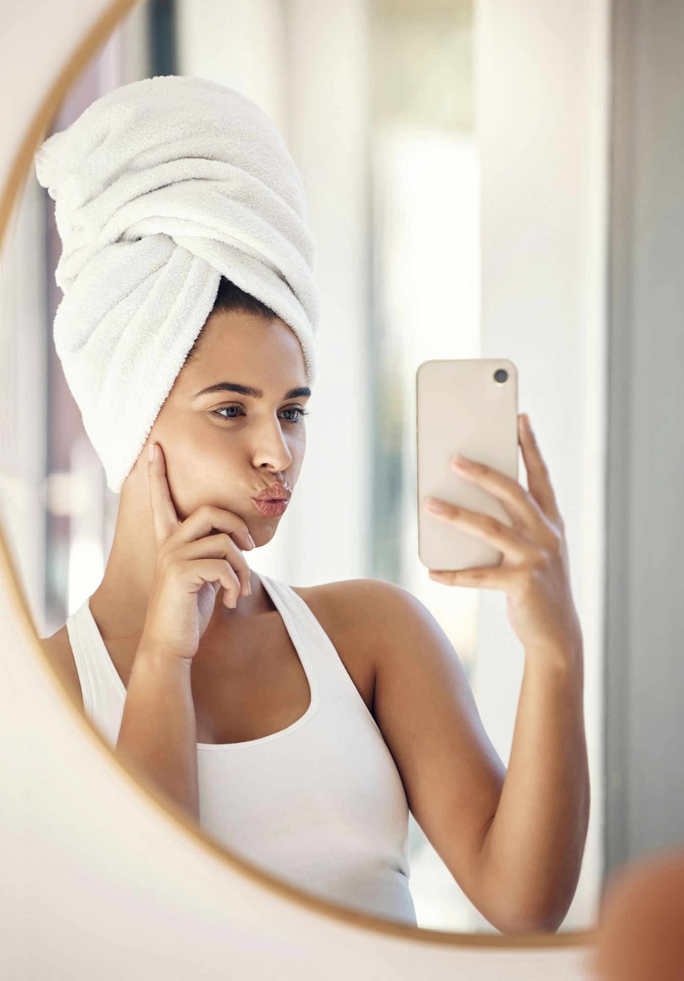 Selfie, skincare and woman with a phone for facial health, cleaning and shower in the bathroom of a